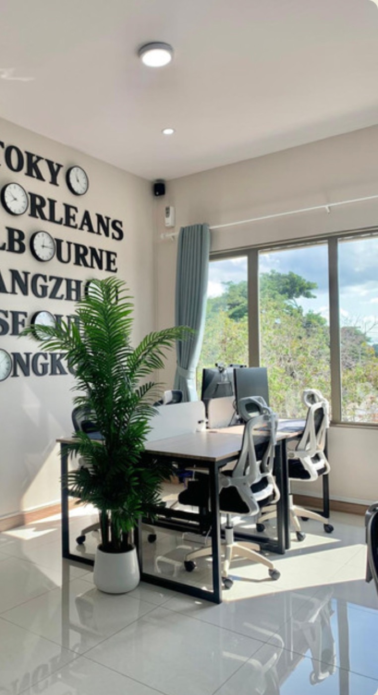 Desks beneath the world-clock wall